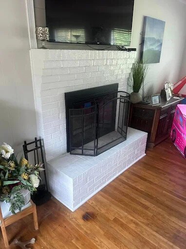 Refinished white fireplace with hearth