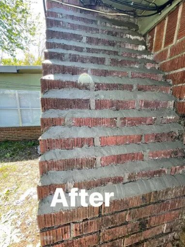 Repointed brick chimney after tuckpointing by Chimney Works